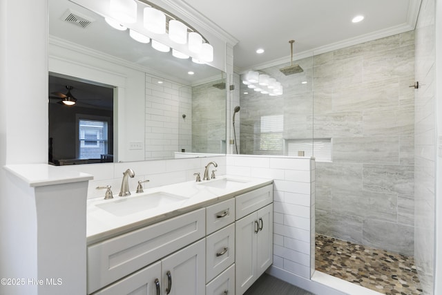 bathroom with a shower, tile walls, and crown molding