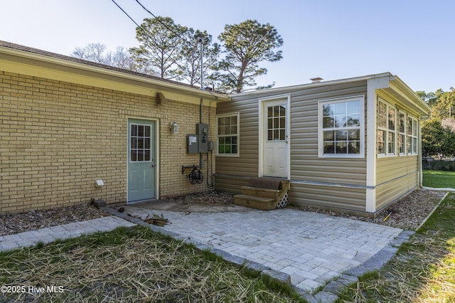 rear view of property with a patio area