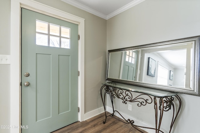 foyer entrance with dark hardwood / wood-style flooring and ornamental molding