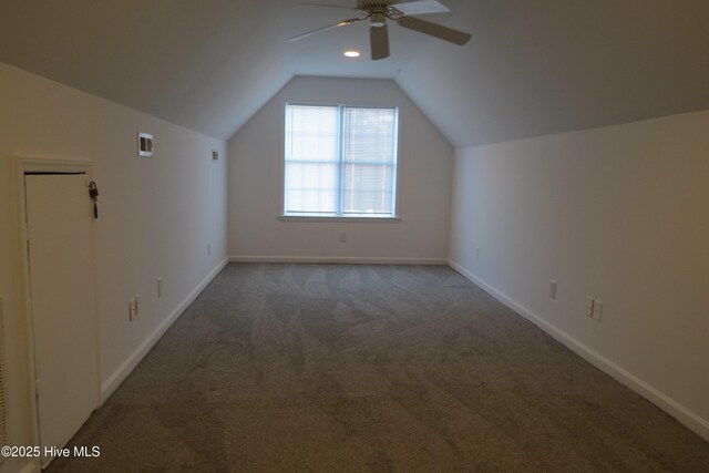 additional living space with carpet, ceiling fan, and vaulted ceiling