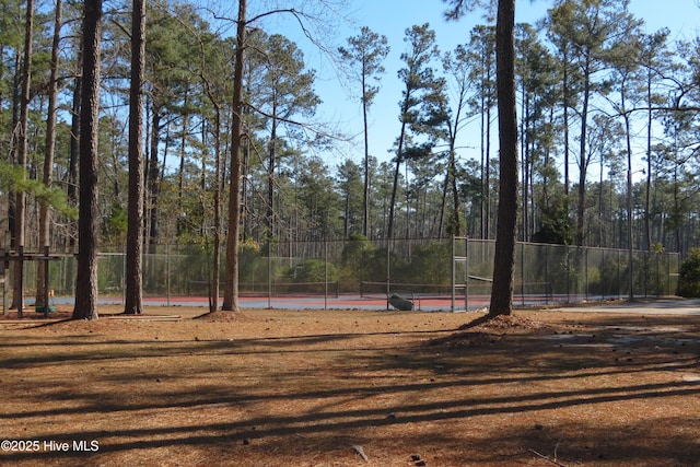 view of yard featuring tennis court