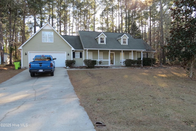 cape cod-style house featuring covered porch and a garage