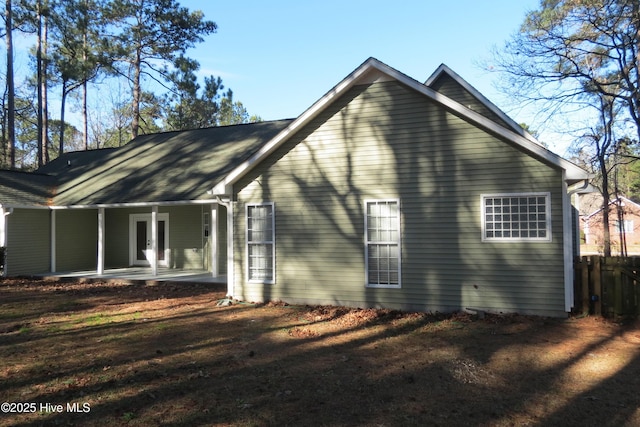 back of property with a patio