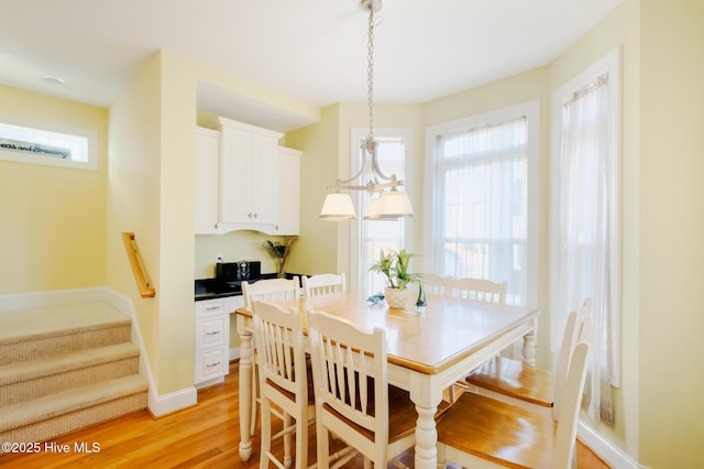 dining space with light wood-type flooring