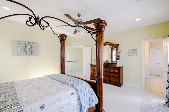 bedroom with ceiling fan and light carpet