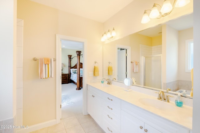 bathroom featuring tile patterned floors, vanity, and an enclosed shower