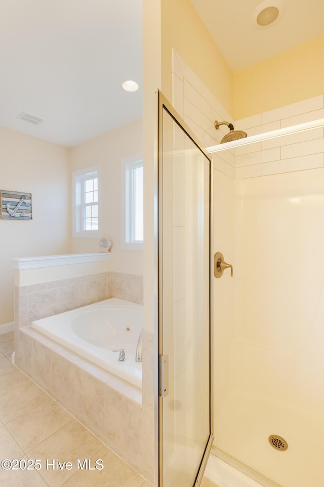 bathroom featuring tile patterned floors and shower with separate bathtub