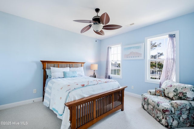 bedroom featuring ceiling fan and light colored carpet