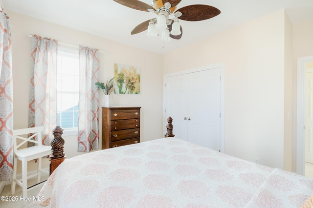 bedroom featuring multiple windows, a closet, and ceiling fan