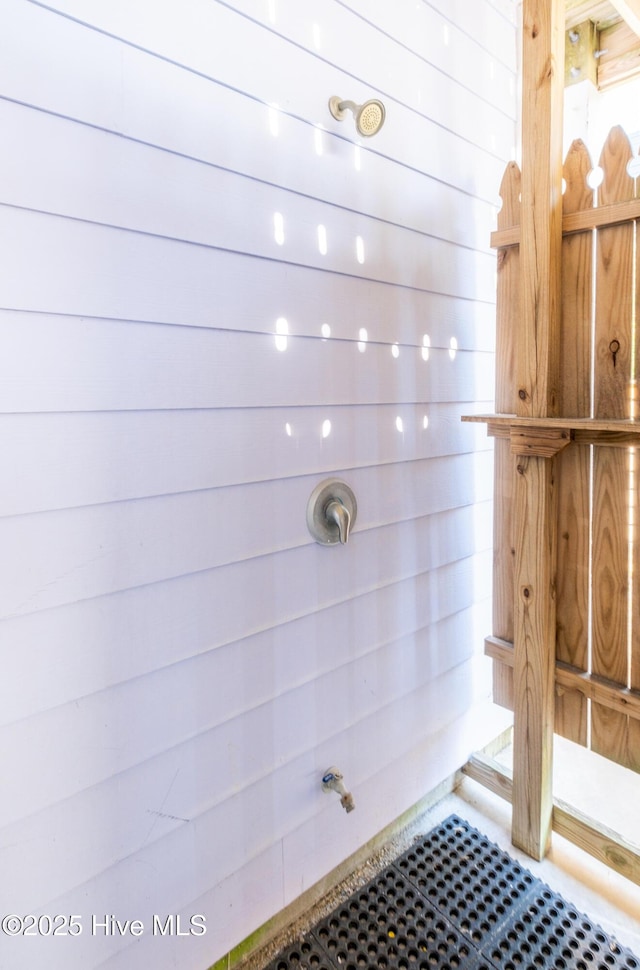 bathroom with wooden walls