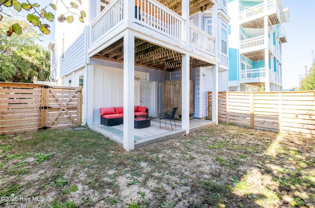 exterior space featuring outdoor lounge area, a patio, and a deck