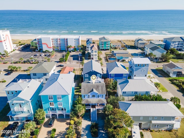 aerial view with a water view and a view of the beach