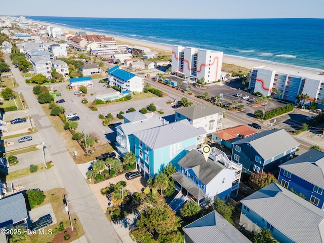 birds eye view of property featuring a view of the beach and a water view