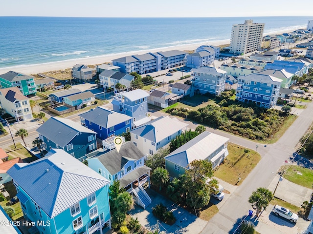 aerial view with a water view and a view of the beach