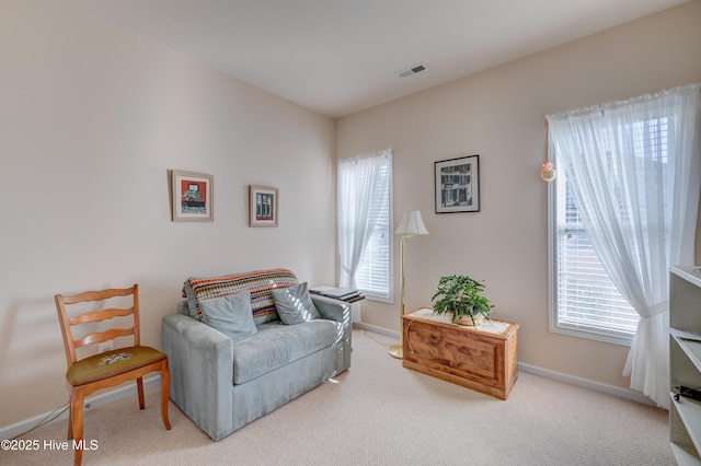 sitting room featuring carpet floors