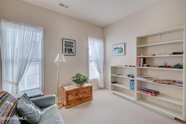 sitting room with light carpet