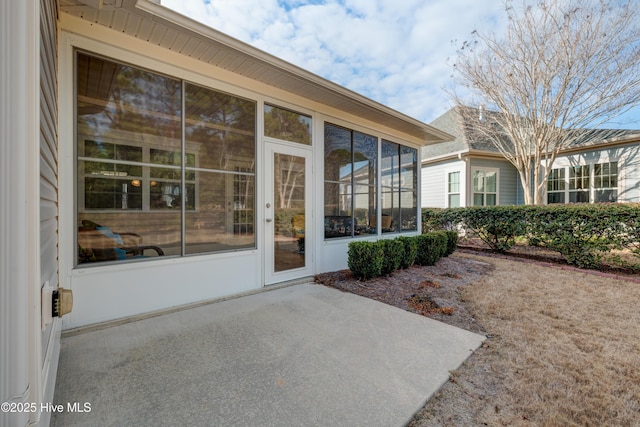 doorway to property featuring a patio area