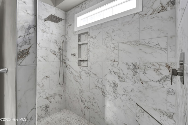 bathroom featuring tiled shower