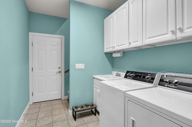 washroom featuring cabinets, separate washer and dryer, and sink