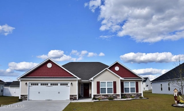 craftsman inspired home with a garage and a front lawn