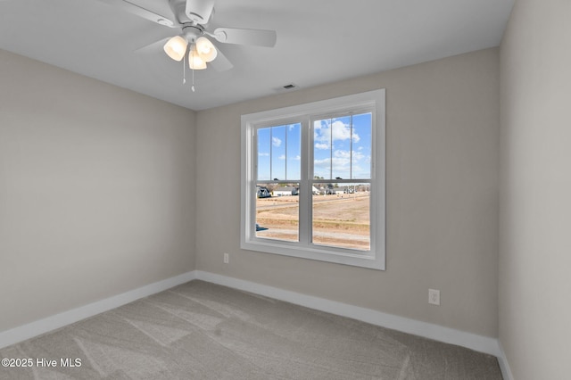 unfurnished room featuring ceiling fan and light colored carpet