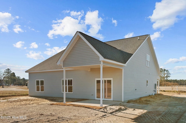 back of property featuring a patio area