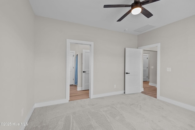 unfurnished bedroom with ceiling fan and carpet floors