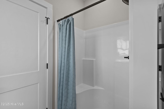 bathroom featuring a shower with curtain