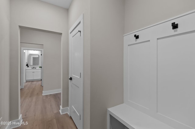 mudroom with light wood-type flooring