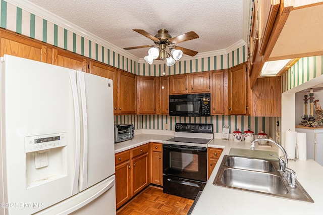 kitchen with range with electric stovetop, white refrigerator with ice dispenser, sink, and a textured ceiling