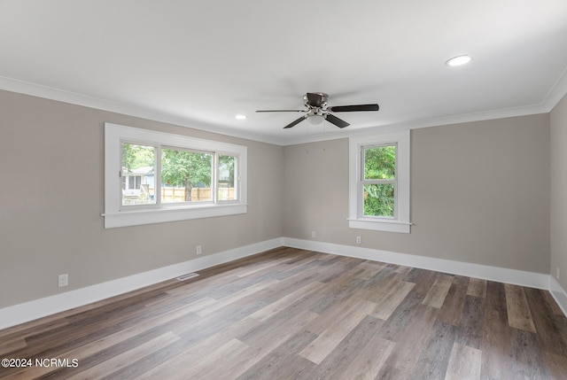 unfurnished room with crown molding, ceiling fan, and light wood-type flooring