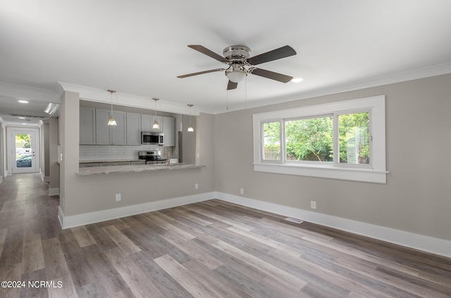 unfurnished living room with crown molding, ceiling fan, and wood-type flooring