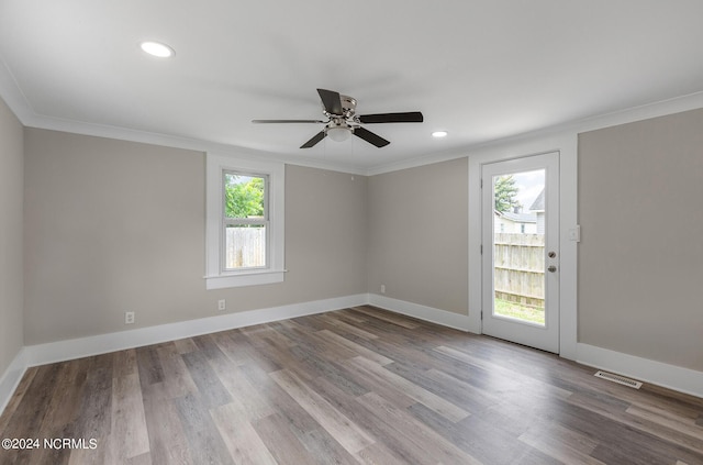 spare room featuring ceiling fan, light hardwood / wood-style floors, and ornamental molding