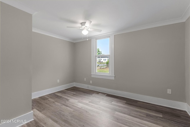 unfurnished room with ceiling fan, crown molding, and hardwood / wood-style flooring