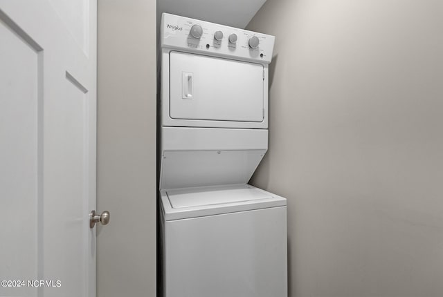 laundry area with stacked washer / drying machine