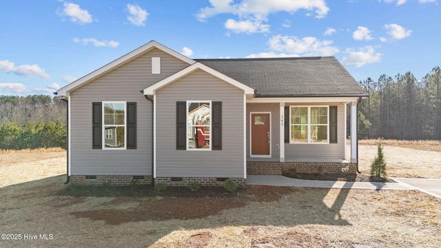 bungalow-style house with entry steps, a shingled roof, and crawl space