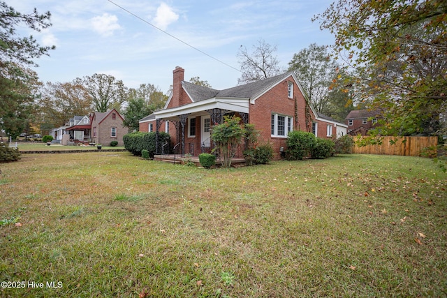 view of home's exterior featuring a yard and a porch