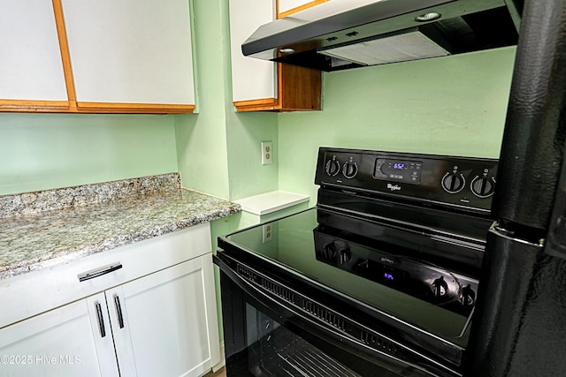 kitchen with white cabinetry, range hood, black electric range oven, and light stone countertops