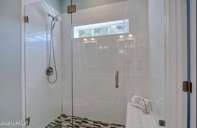 bathroom featuring walk in shower