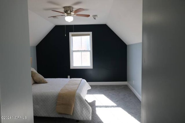 bedroom featuring carpet flooring, vaulted ceiling, and ceiling fan