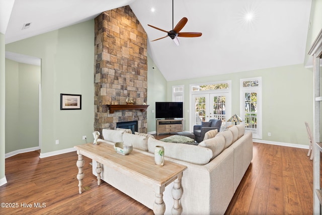 4379 Gauntlet Dr, Southport, NC 28461 - living area featuring high vaulted ceiling, ceiling fan, wood finished floors, baseboards, and a fireplace