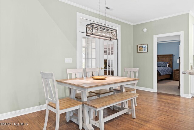 kitchen with appliances with stainless steel finishes, white cabinetry, french doors, and sink