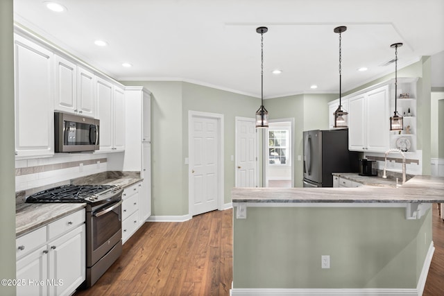4379 Gauntlet Dr, Southport, NC 28461 - kitchen with stainless steel appliances, open shelves, white cabinetry, decorative backsplash, and crown molding