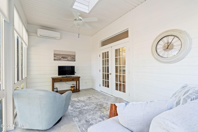 4379 Gauntlet Dr, Southport, NC 28461 - sunroom with french doors, a wall mounted air conditioner, a ceiling fan, and a skylight