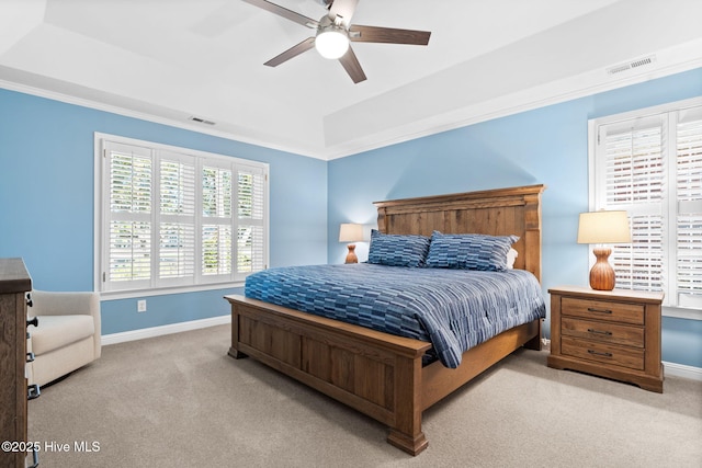 4379 Gauntlet Dr, Southport, NC 28461 - carpeted bedroom with baseboards, a raised ceiling, a ceiling fan, and crown molding