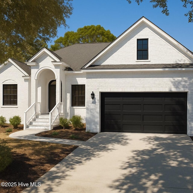 4379 Gauntlet Dr, Southport, NC 28461 - view of front of house featuring concrete driveway, brick siding, and a garage