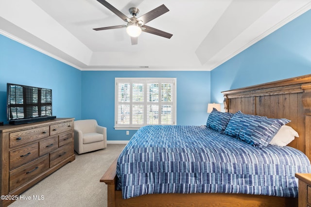 4379 Gauntlet Dr, Southport, NC 28461 - bedroom with a raised ceiling, light colored carpet, and ceiling fan