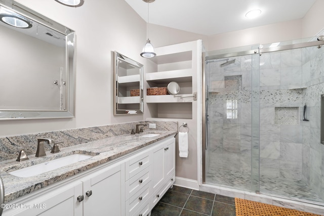 4379 Gauntlet Dr, Southport, NC 28461 - bathroom with double vanity, a shower stall, baseboards, and tile patterned floors