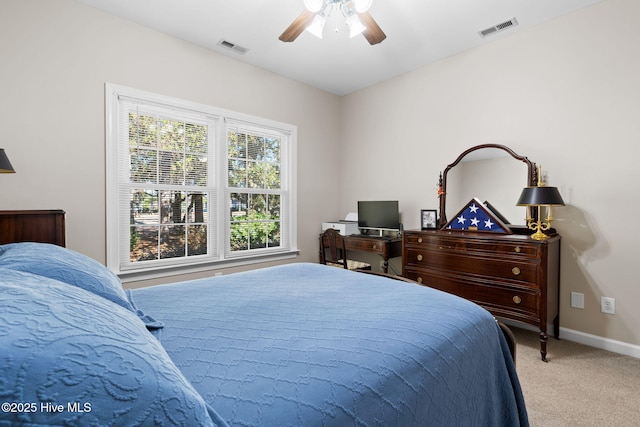 4379 Gauntlet Dr, Southport, NC 28461 - bedroom with light carpet, baseboards, and ceiling fan