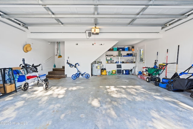 4379 Gauntlet Dr, Southport, NC 28461 - garage with a garage door opener and electric water heater